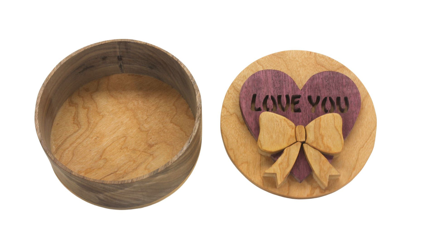 Round storage box with heart and bow on top