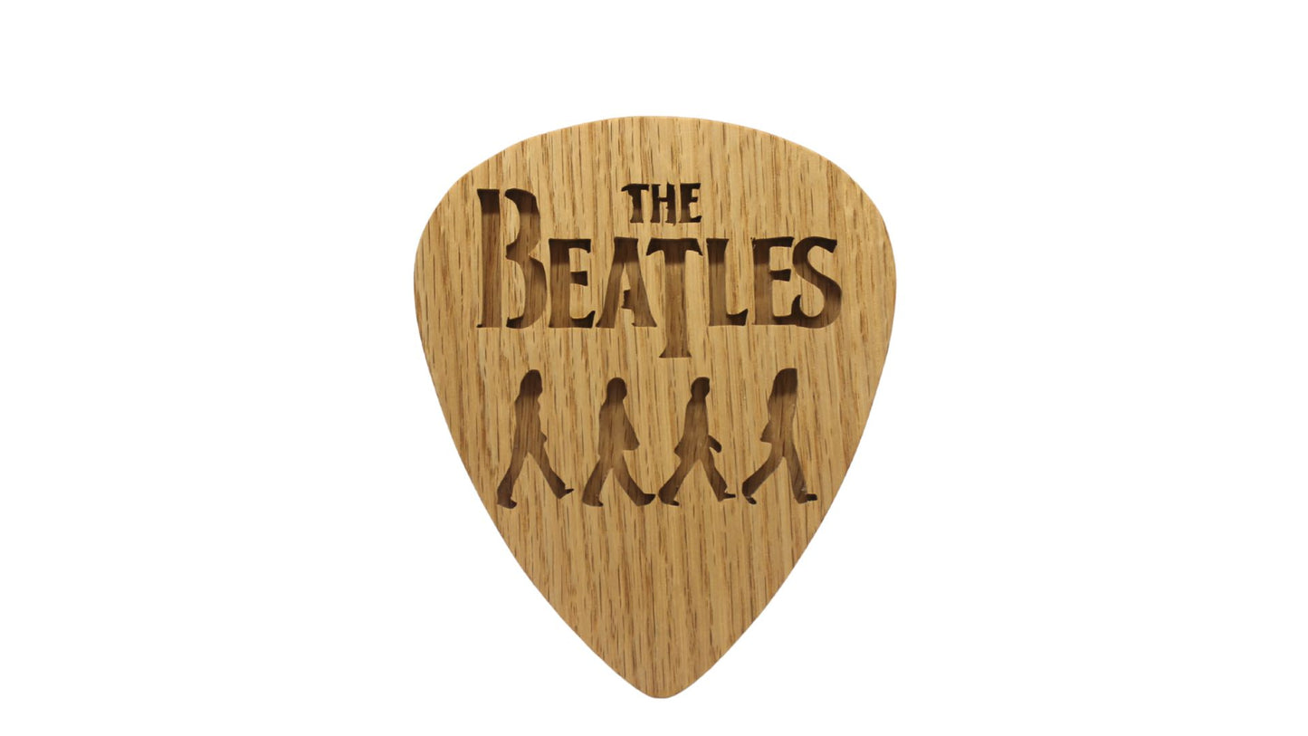 Beatles crossing Abbey Road on giant guitar pick shape, choice of oak or cherry. Decoration only, cannot be used as an actual guitar pick
