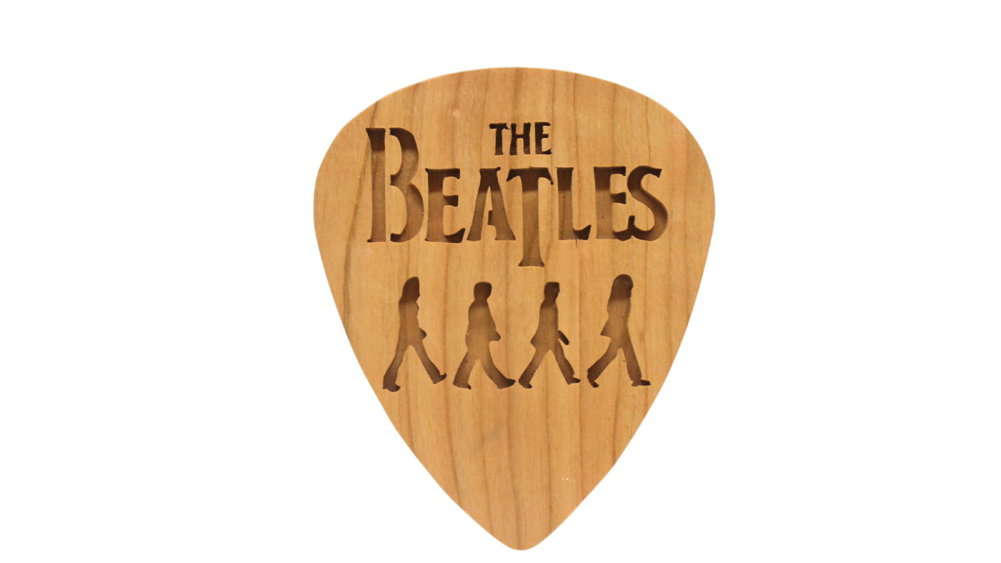 Beatles crossing Abbey Road on giant guitar pick shape, choice of oak or cherry. Decoration only, cannot be used as an actual guitar pick