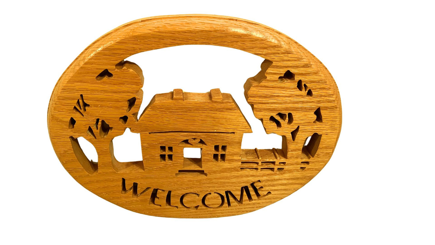 Oval welcome sign, hand cut from solid oak. This makes a great entry door or hall wall hanging
