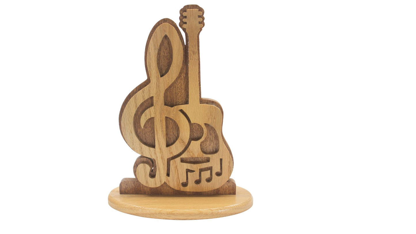 Guitar music display. Choice of stand or wall hanging. Cut by hand from oak and sapele