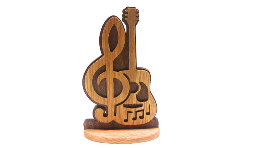Guitar music display. Choice of stand or wall hanging. Cut by hand from oak and sapele