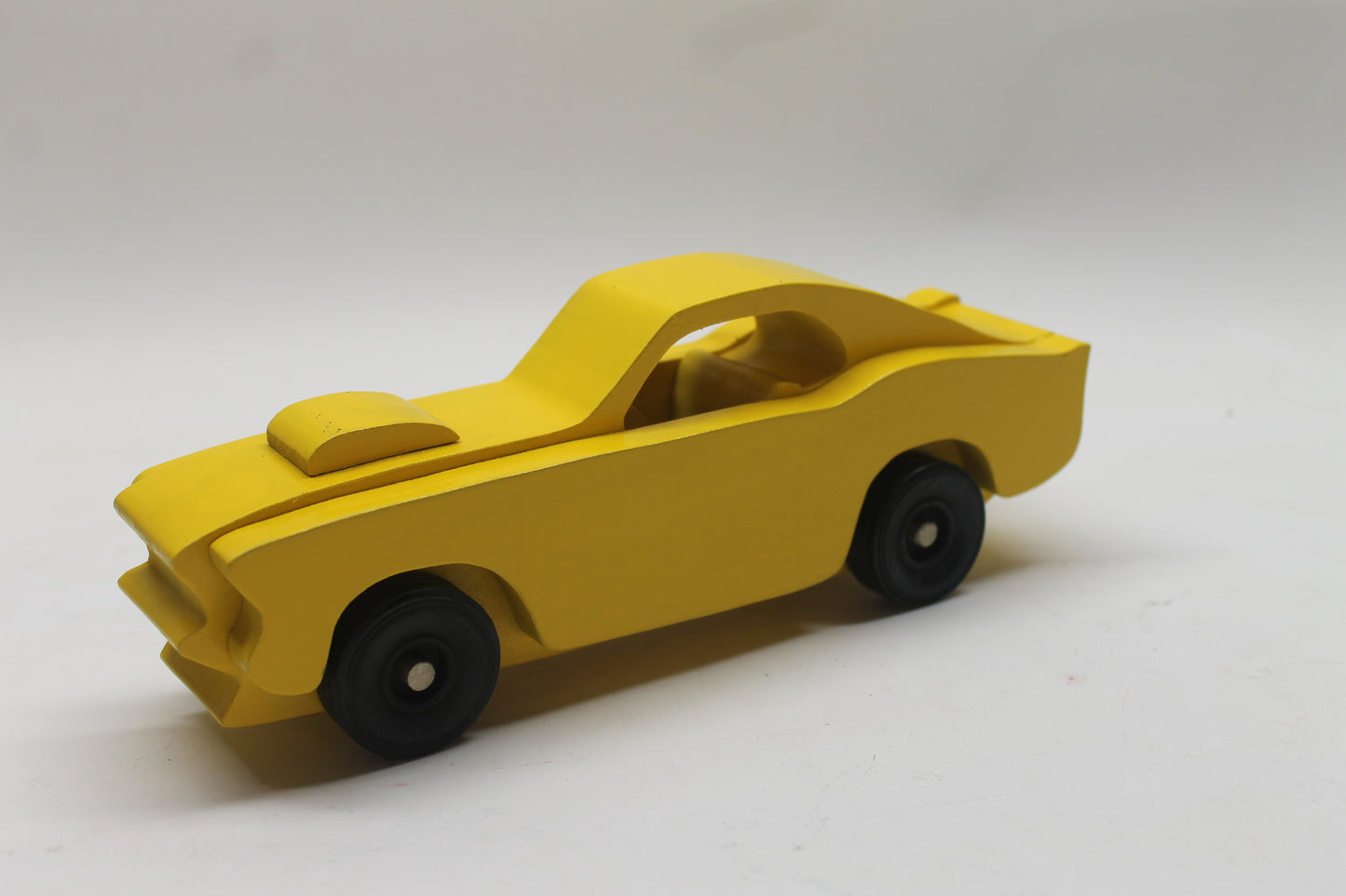 Handcrafted 1969 Mustang Fastback Model in Solid Hardwood. Choice of Red or Yellow